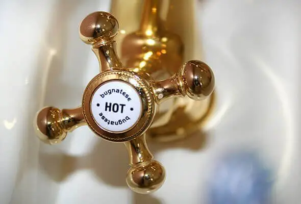 Close-Up Of A Hot Water Faucet With Steam Rising, Indicating Active Water Heating – Page Tradie Plumbing &Amp; Gas Experts