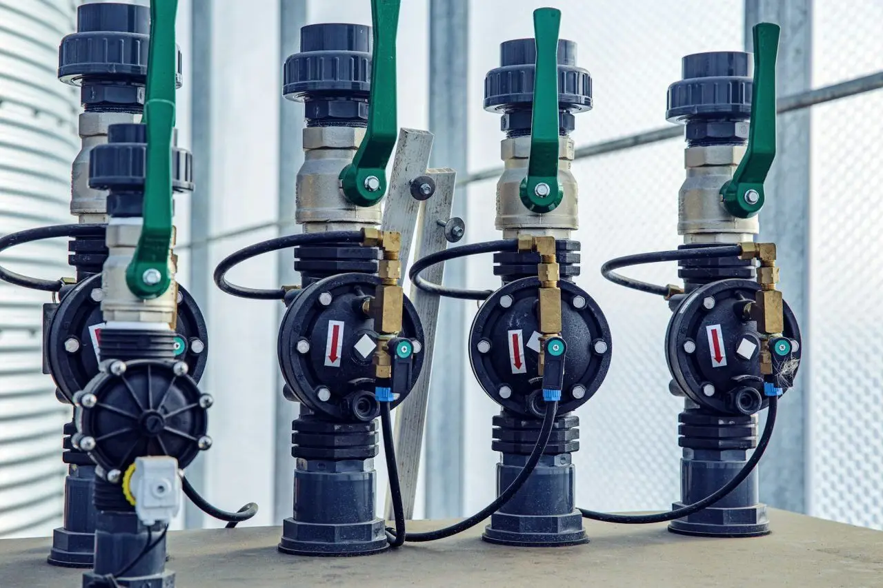 Complex setup of valves, cables, and water pipes in a modern plumbing installation – PAGE Tradie Plumbing & Gas Engineers